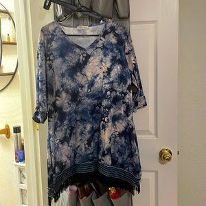 Indigo soul tie dyed three-quarter inch sleeve tunic with fringe along bottom